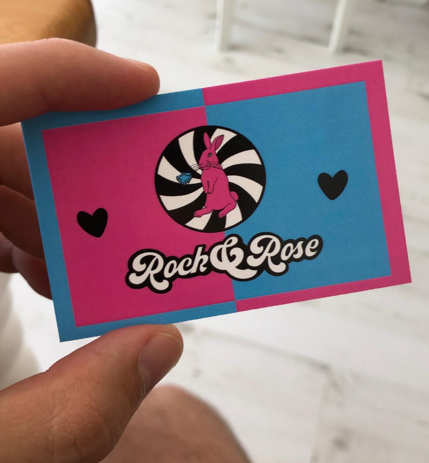 Business card for RockandRose, featuring the rabbit Logo and a pink and blue theme.