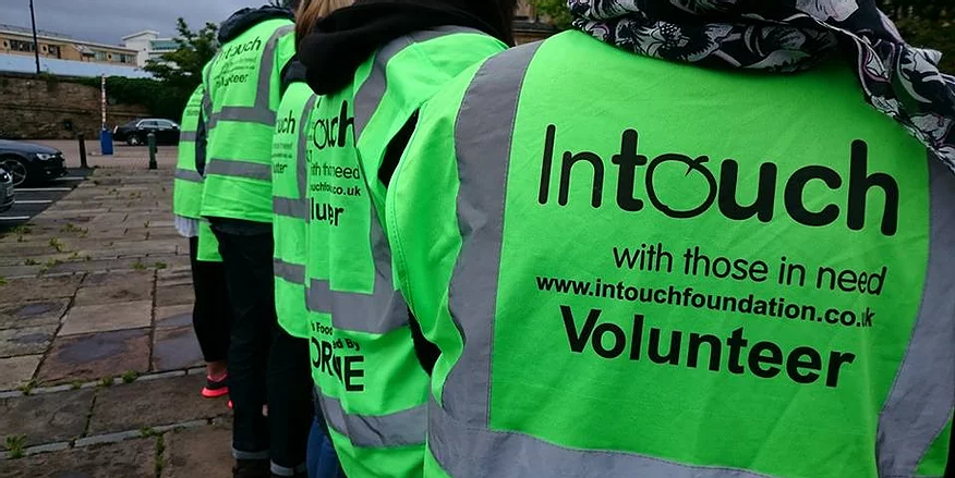 Five Intouch foundation volunteers on a line