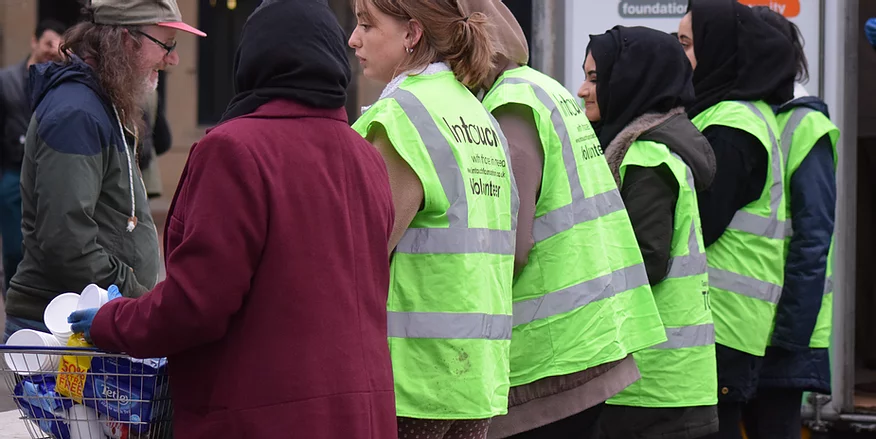 Some of the intouch team helping serve food to those in need